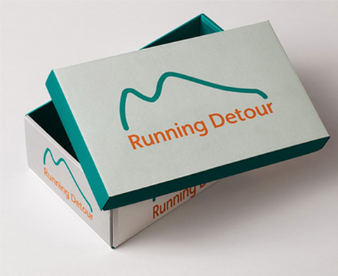 Running Detour logo printed on shoebox lid