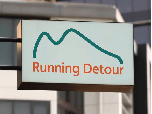 Running Detour logo on exterior storefront sign